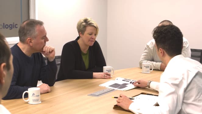 The audiologic team around a meeting table